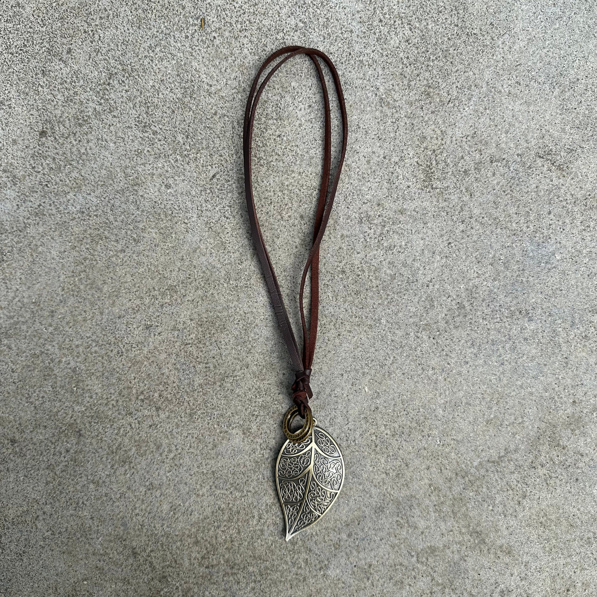 Ornate leaf necklace with brown cord for LARP.