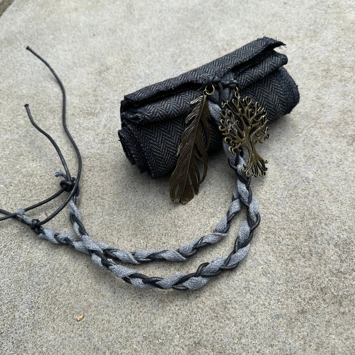 Medieval LARP sash in herringbone wool with tree and feather charms.