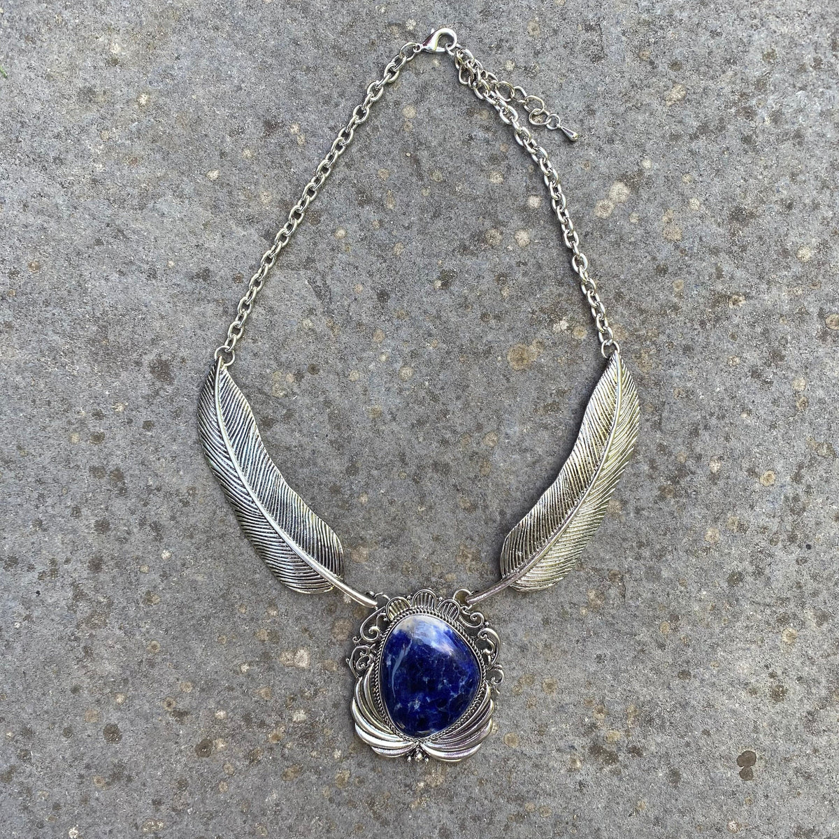 Silver feather necklace with central lapis lazuli for LARP.