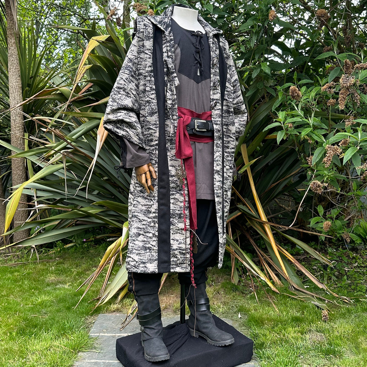 Angled front view of two-tone beige and black LARP robe, medieval fantasy cosplay costume with.