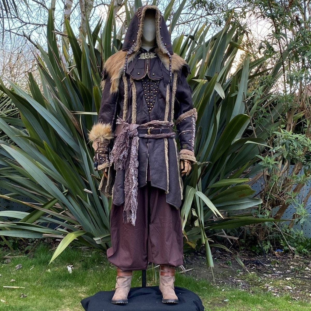 Medieval LARP outfit with hood, fur accents, and detailed vambraces.
