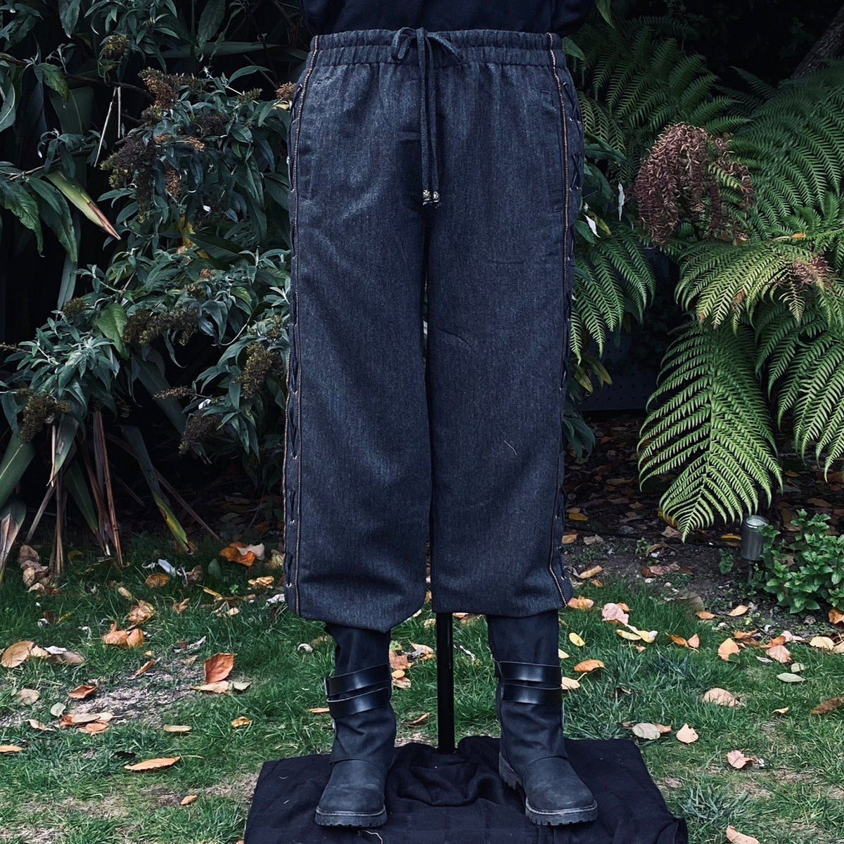 LARP medieval grey wool pants with side lace, front view.