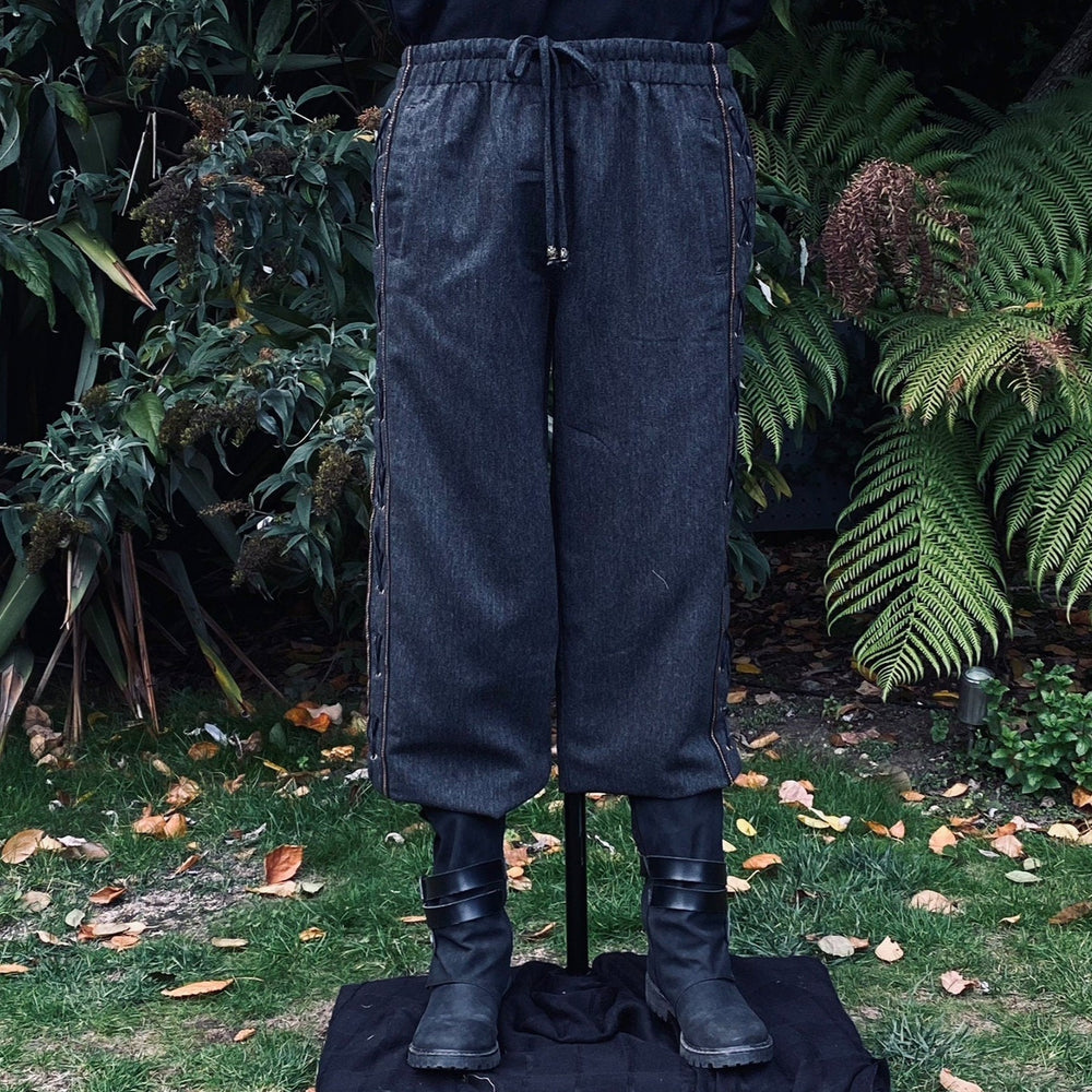 grey wool medieval pants with side lace and braid trim
