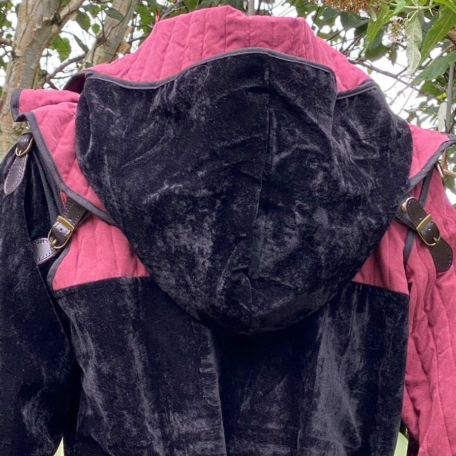 This Padded LARP Hood comes in Black and Red Faux Suede. This Viking Hood has a Snood style, and is Water Resistant. The Gambeson Mantle of the Medieval Hood keeps you warm and dry. Perfect for your LARP Character and LARP Costume, Cosplay Event, and Ren Faire.