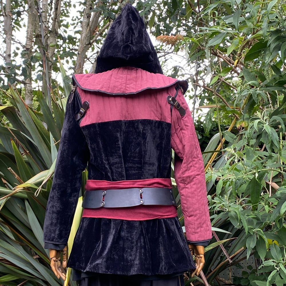 Medieval LARP Costume Set. Gambeson Hood, and Jacket with removable sleeves. Outfit for Renaissance Faire, Cosplay, Fantasy, and Roleplay Events. Made from Red and Black Suede Effect, Cotton, Metal Buckles and Magnetic Poppers. Back Full Outfit with Hood up.