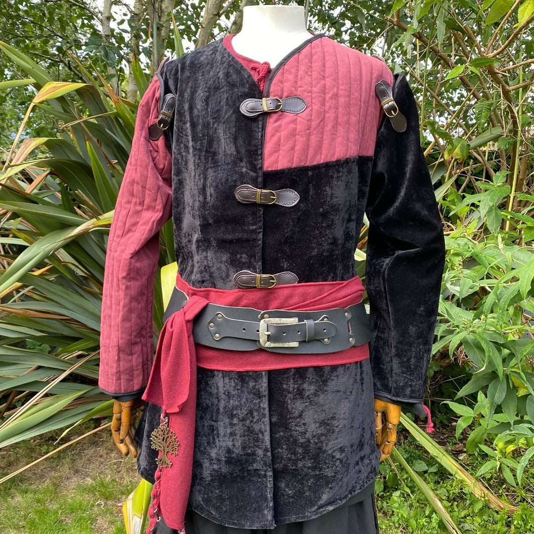 This LARP Gambeson Jacket comes in Black & Red Faux Suede. The LARP Armor has Removeable Sleeves that attach at the shoulder. The Padded Armor is warm and water resistant. This Jacket is perfect for your LARP Costume and LARP Character, Cosplay Events, and Ren Faires.