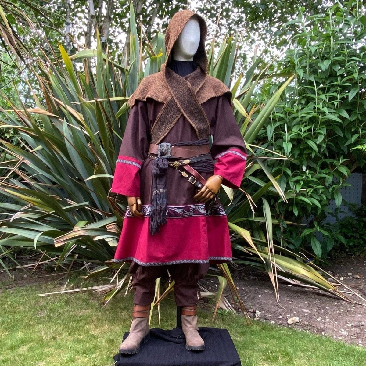 Medieval LARP outfit front view, featuring a brown and red Viking tunic, wrap around hood and.