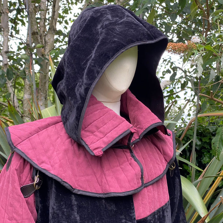 This Padded LARP Hood comes in Black and Red Faux Suede. This Viking Hood has a Snood style, and is Water Resistant. The Gambeson Mantle of the Medieval Hood keeps you warm and dry. Perfect for your LARP Character and LARP Costume, Cosplay Event, and Ren Faire.