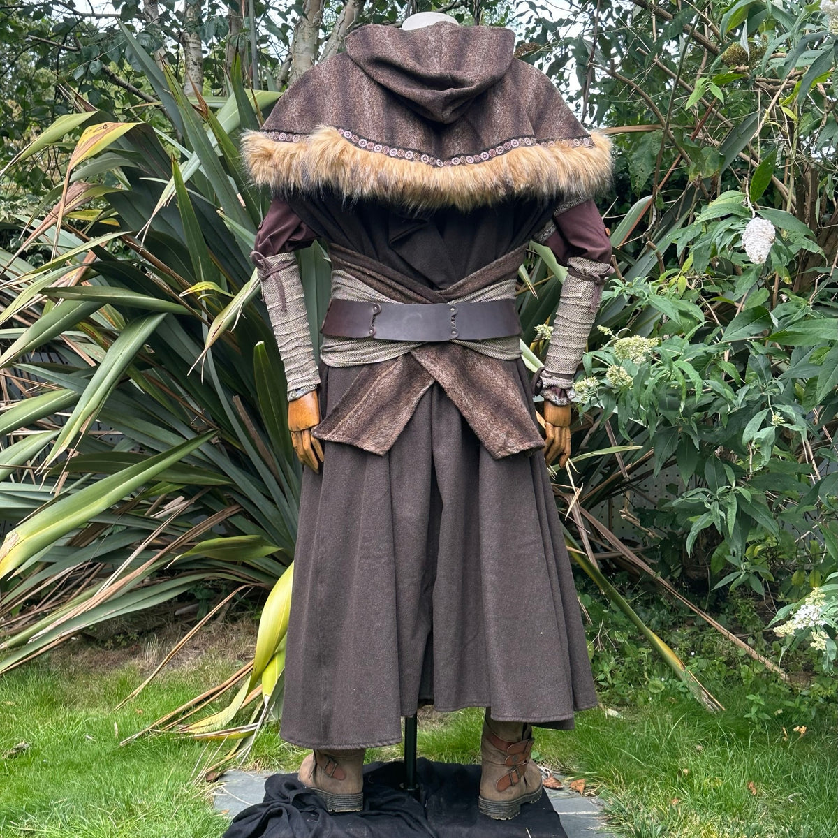 Medieval LARP costume back view featuring brown hooded cloak, fur trim hood, arm wraps, leather.