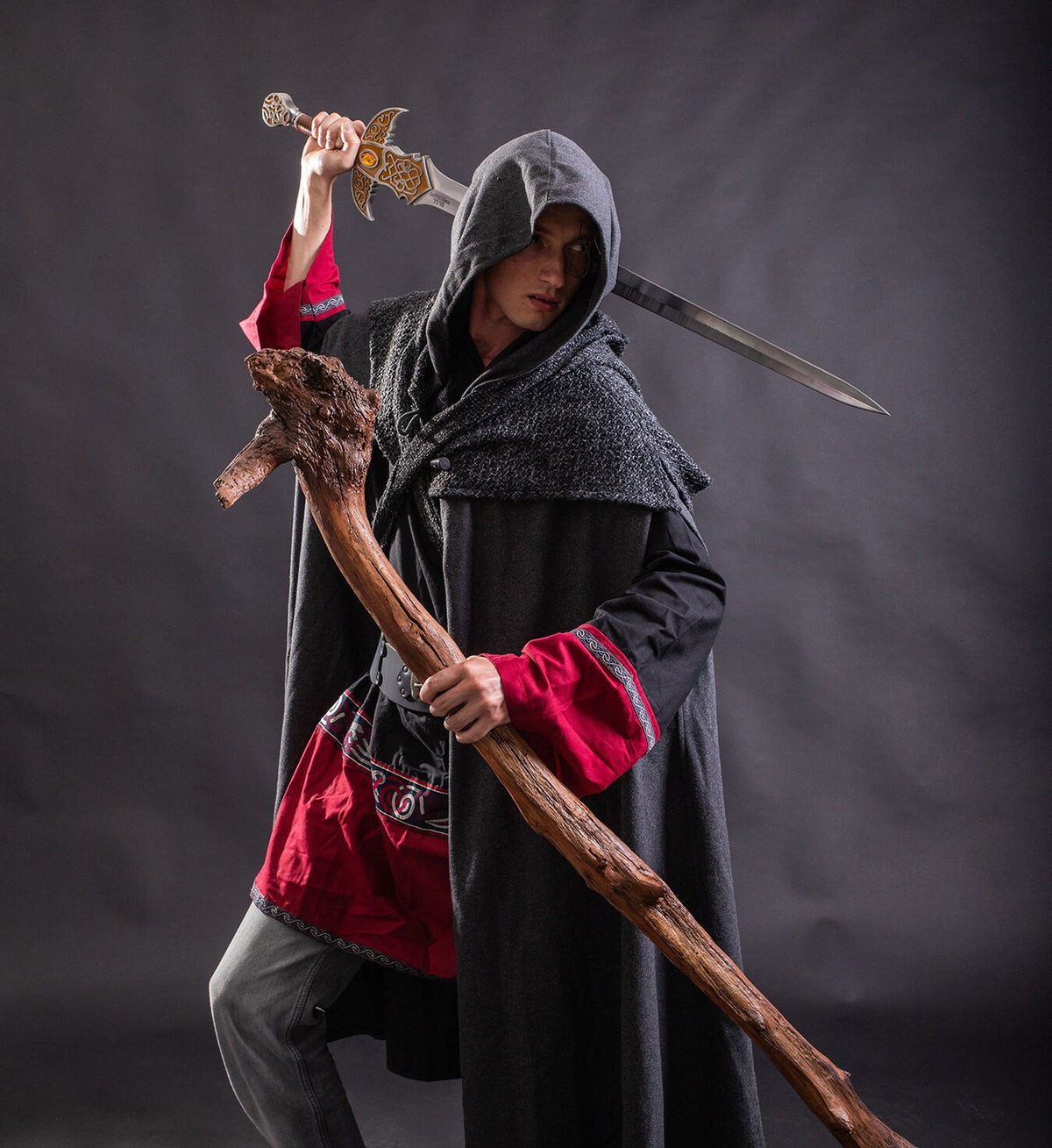 Angled view of grey hooded LARP cloak with sword, authentic medieval fantasy cosplay costume for.